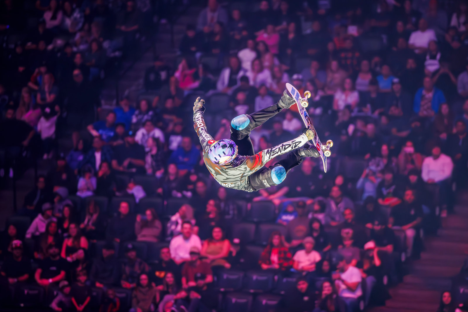 Beaver Fleming mid-air skate flip at a Nitro Circus stadium show